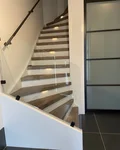 Traprenovatie met glasbalustrade nieuwbouw woning